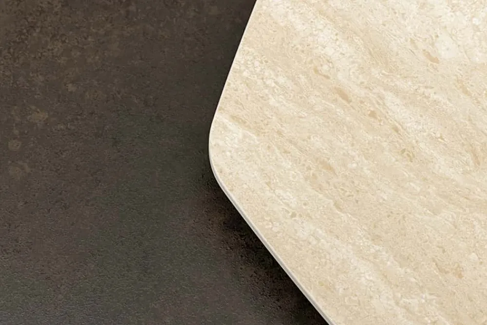 Riess-Ambiente Couchtische & Truhen > Design Couchtisch MOVEMENT rost Pentagon drehbar Travertin Keramik schwarz Metall