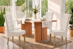 Riess-Ambiente Stühle > Design Stuhl CASA beige Strukturstoff Massivholzbeine mit Zierknöpfen und Nackenrolle