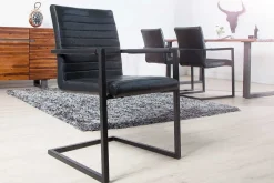 Riess-Ambiente Freischwinger|Industrial Loft > Industrial Freischwinger Stuhl LOFT antik schwarz Kunstleder mit Armlehne Eisengestell
