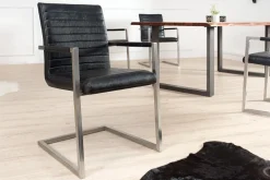 Riess-Ambiente Freischwinger|Industrial Loft > Industrial Freischwinger Stuhl LOFT antik schwarz Kunstleder mit Armlehne Edelstahl