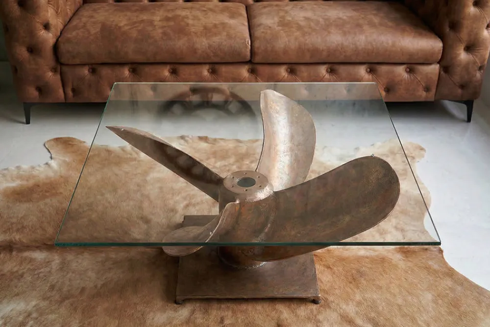 Riess-Ambiente Couchtische & Truhen > Maritimer Couchtisch OCEAN L 85cm antik kupfer mit Schiffsschraube und Glasplatte