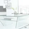 Riess-Ambiente Couchtische & Truhen > Moderner Glas Couchtisch FANTOME 70cm Trapez mit Ablage transparent