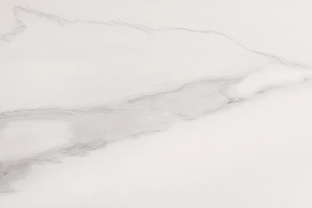 Riess-Ambiente Esstische > Runder Esstisch SIGNATURE 135cm weiß Marmor Keramik schwarzes Metallgestell Säulenfuß